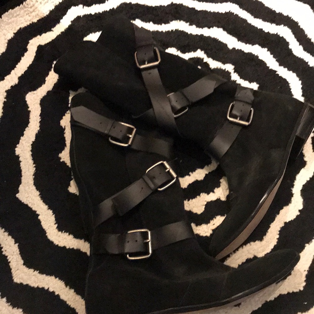 Tall buckled boots